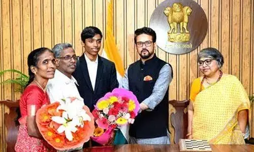 Sports Minister Anurag Thakur honours chess GM R. Praggnanandhaa and his parents