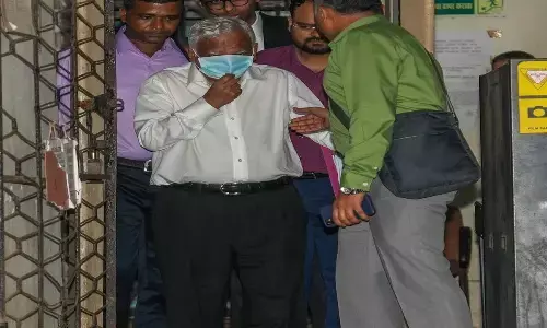 Enforcement Directorate officials produce Jet Airways founder Naresh Goyal before a court a day after his arrest in a money laundering case, in Mumbai on Saturday