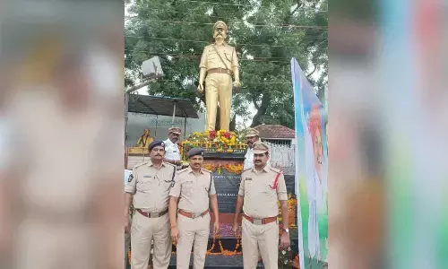 Additional SP K Nageswara Rao and other police officers after paying floral tributes to IPS officer late Solomon Wesley in Ongole on Saturday 