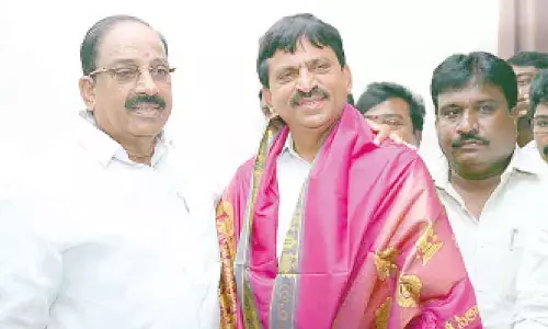 Former Minister Tummala Nageswara Rao felicitating former MP and Congress leader Ponguleti Srinivas Reddy at his camp office in Khammam on Saturday
