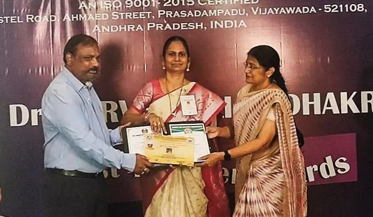 Best Teacher award being presented to Assistant Prof Dr Udaya Sri in Vijayawada on Sunday