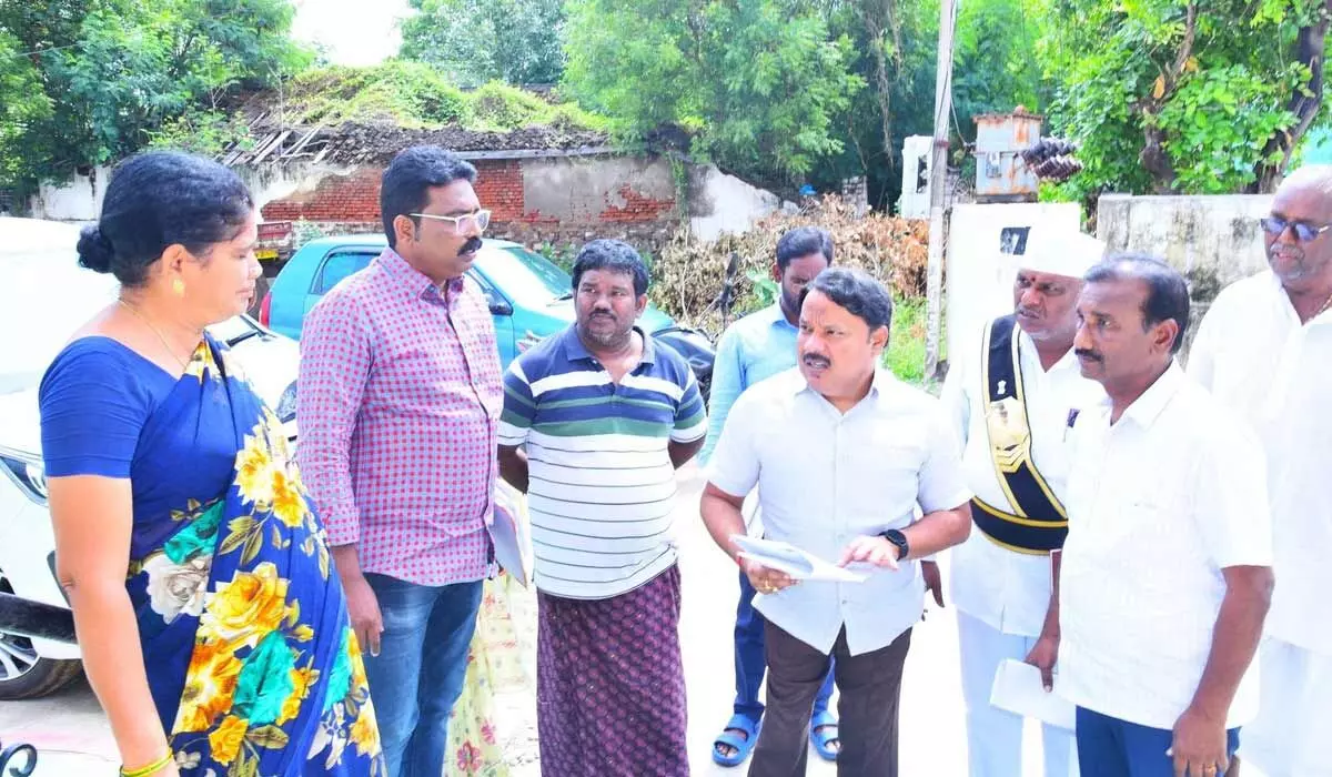 District in-charge Collector K Srinivasulu inspecting voters reverification process in Tangutur mandal on Sunday