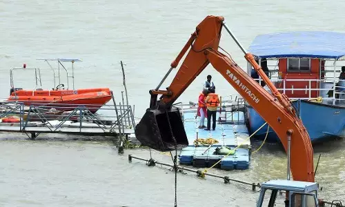 Cleaning process going on at Durga ghat in Vijayawada on Sunday Photo: Ch Venkata Mastan