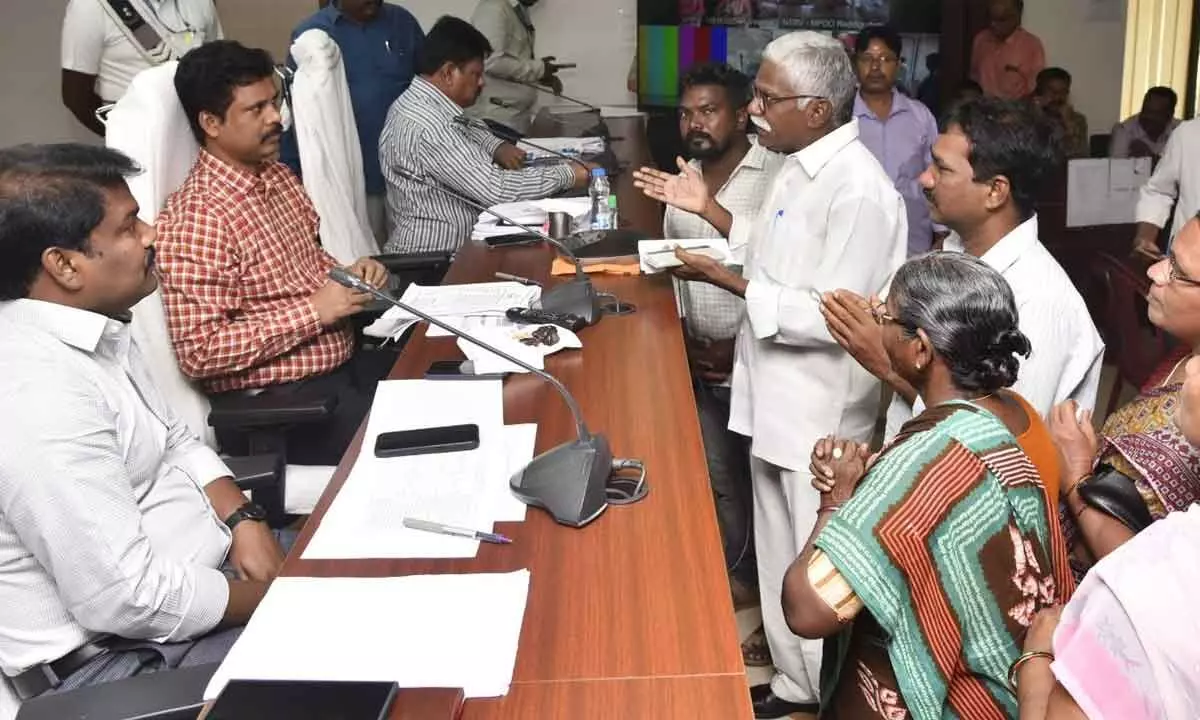 NTR district Collector S Dilli Rao receiving petitions from the people during Spandana programme at the Collectorate in Vijayawada on Monday