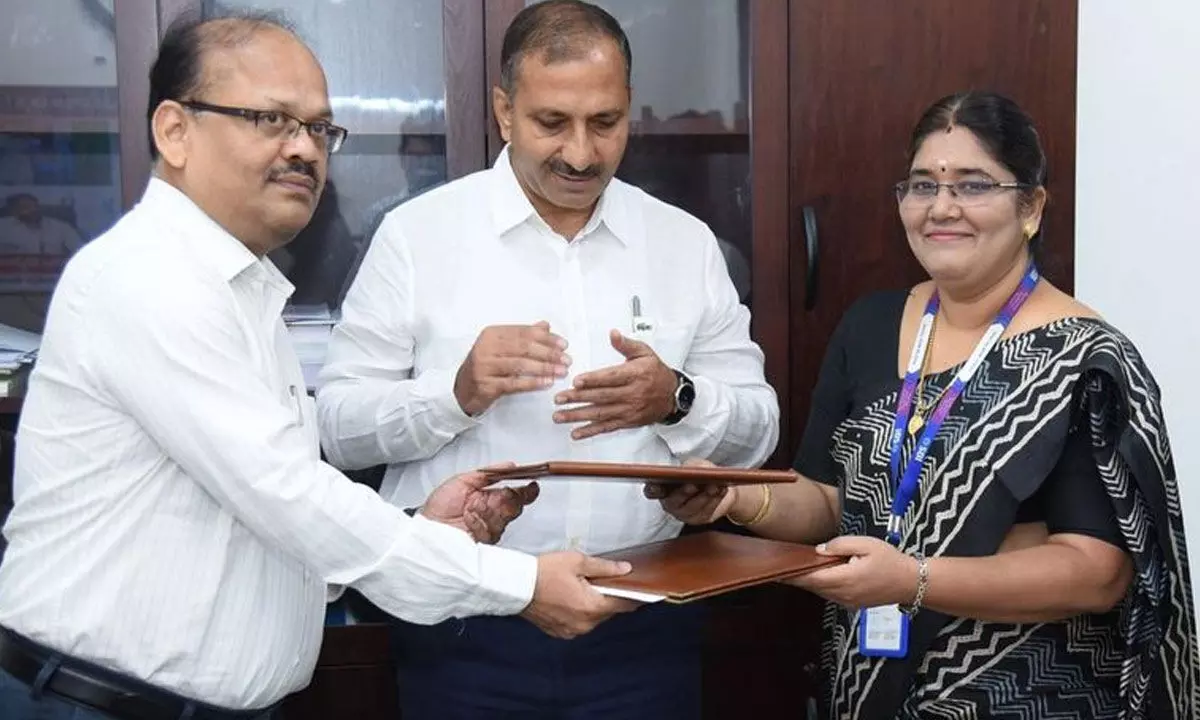AP Food Processing Society CEO Sridhar Reddy, principal secretary (food processing, agri-marketing and cooperation) Chiranjeevi Choudhary and SBI DGM V Hema exchange copies of MoU signed for development of food processing units at the Secretariat in Velagapudi on Tuesday