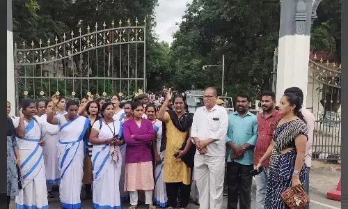 Members of women organisations and Asha workers staging a protest at TTD administrative office in Tirupati on Tuesday