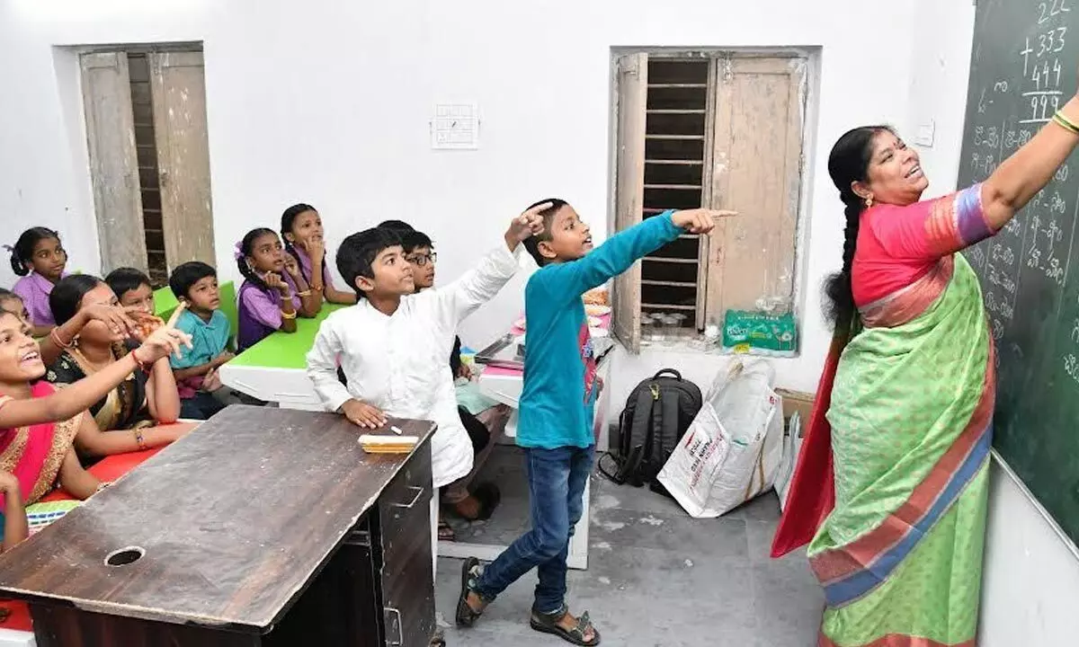 Mayor G Hari Venkata Kumari imparting lessons to students at mandal parishad primary school, Arilova, in Visakhapatnam on Tuesday