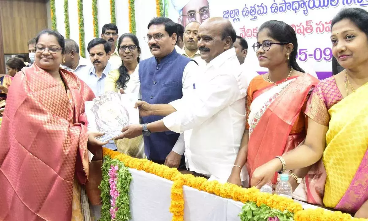 MP N Reddappa presenting memento to Best Teacher awardees during Teachers Day celebration held in Chittoor on Tuesday. Joint Collector Srinivasulu is also seen.