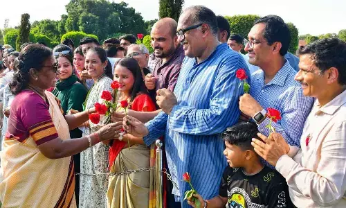 President Droupadi Murmu interacts with the teachers visiting Amrit Udyan from various states on Teachers Day, at Rashtrapati Bhavan, in New Delhi on Tuesday