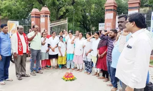 National Health Mission members playing Bathukamma at the Collectorate in Karimnagar on Wednesday