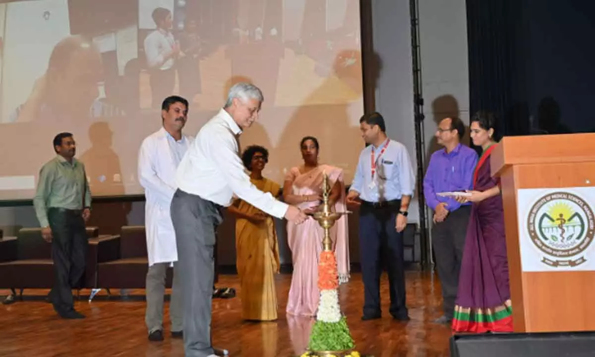 Dr Mukesh Tripathi, Director, AIIMS Mangalagiri lighting lamp to mark inauguration of Chandryaan Mahotsav at AIIMS in Mangalagiri on Friday