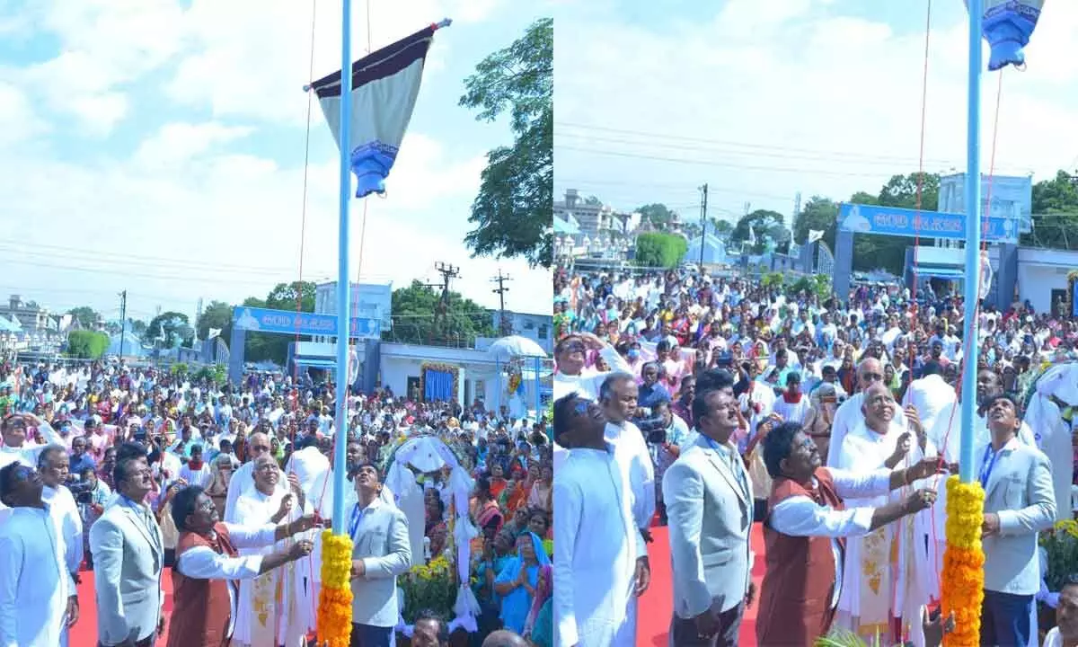 Vijiayawada Bishop Telagathoti Joseph Raja Rao unfurling the flag to launch the centenary celebrations of Gunadala Matha shrine in Vijayawada on Saturday