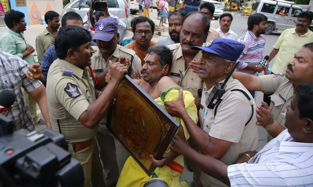 TDP Tirupati parliamentary constituency in-charge G Narasimha Yadav being taken into preventive custody by police in Tirupati on Monday.