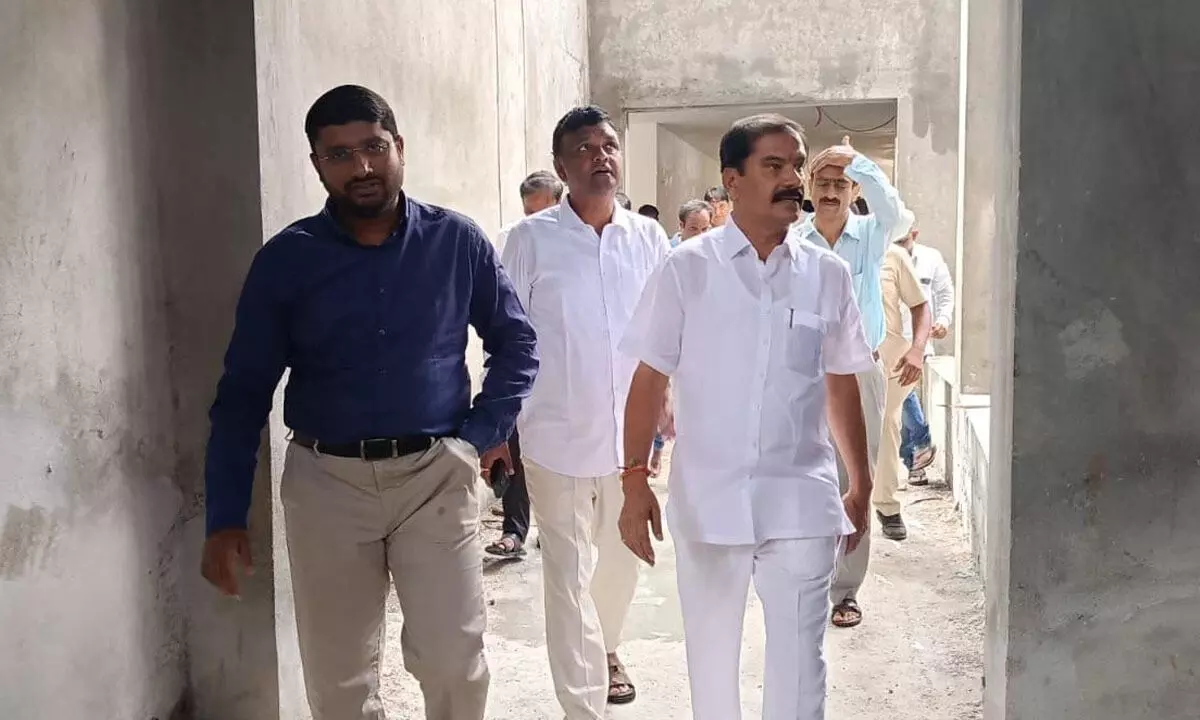 Chief Whip D Vinay Bhaskar, Kakatiya Urban Development Authority (KUDA) chairman Sunder Raj Yadav and municipal commissioner Rizwan Basha Shaikh inspecting the under-construction Kaloji Kalakshetram in Hanumakonda on Monday