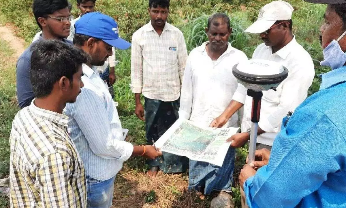 Officials carrying out agriculture land survye as part of ‘YSR Jagananna Saswata Bhu Hakku-Bhu Raksha Scheme’