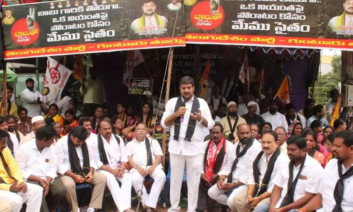 TDP Guntur West Assembly constituency in-charge Naseer Ahmed addressing the relay fast camp at Sri Vasavi Kanyaka Parameswari Temple in Guntur on Thursday. Former MLC Dr Rayapati Srinivas, JSP state secretary Bonaboina Srinivas Yadav are also seen