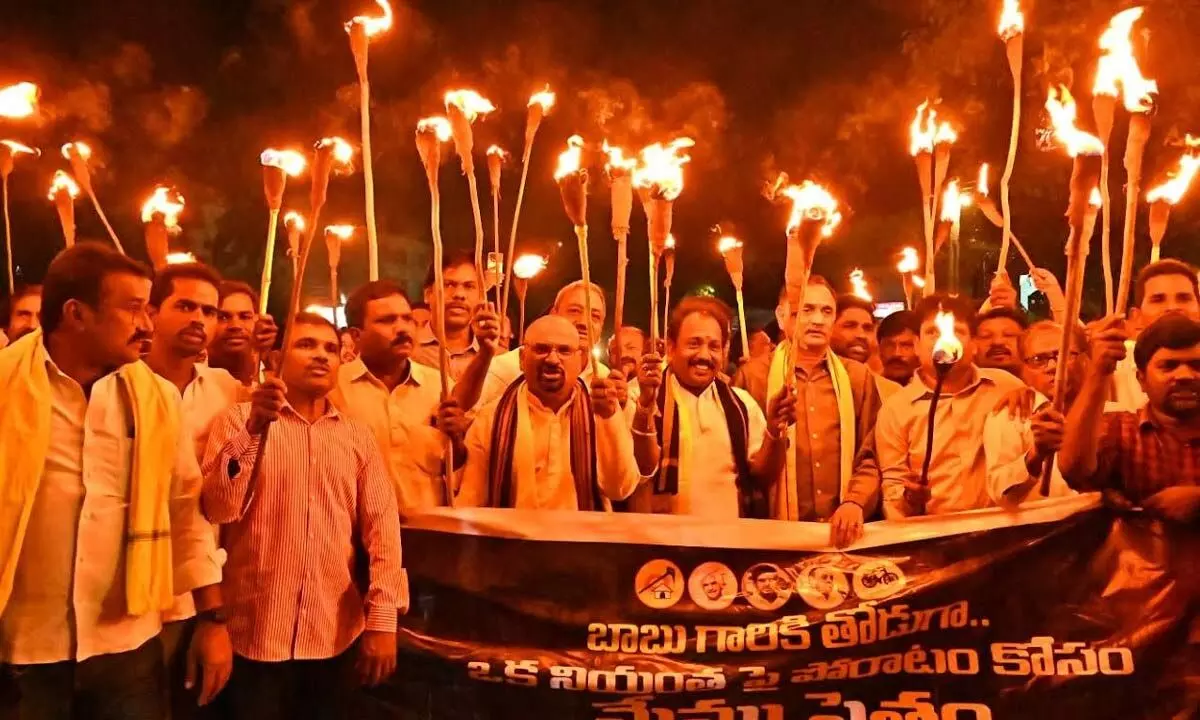 TDP leaders take out a torch rally for the release of the party chief N Chandrababu Naidu in Visakhapatnam on Saturday