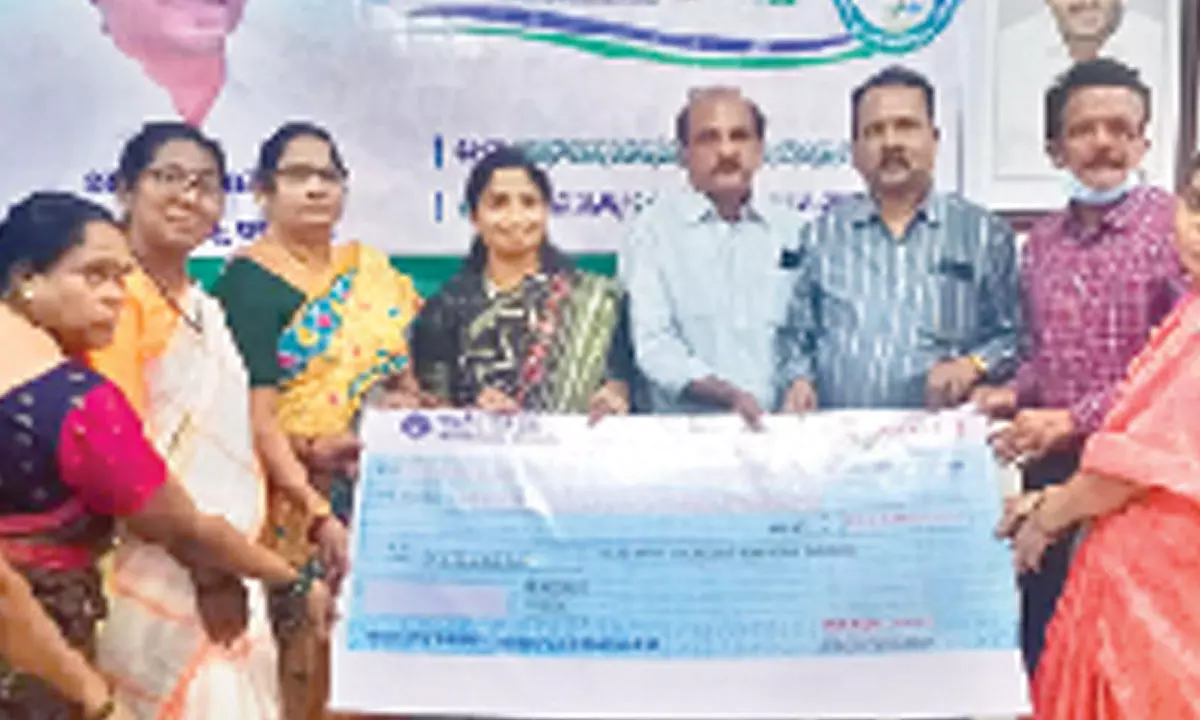 Mayor Dr R Sirisha presenting a replica of YSR Kapu Nestham cheque in Tirupati on Saturday.