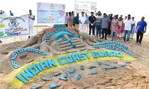 A sand art designed as a part of the beach cleanup activity organised by Indian Coast Guard in Visakhapatnam on Saturday