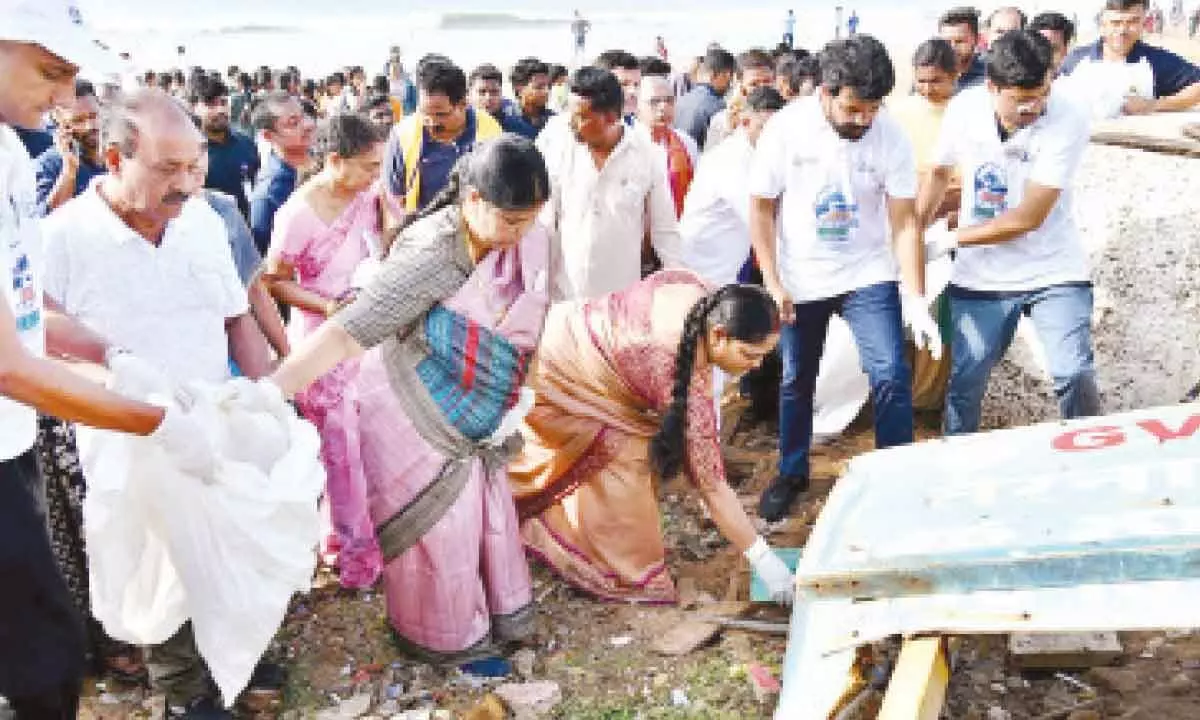 Mayor G Hari Venkata Kumari, Collector A Mallikarjuna and GVMC Commissioner CM Saikanth Varma, among others  cleaning up the beach in Visakhapatnam on Sunday