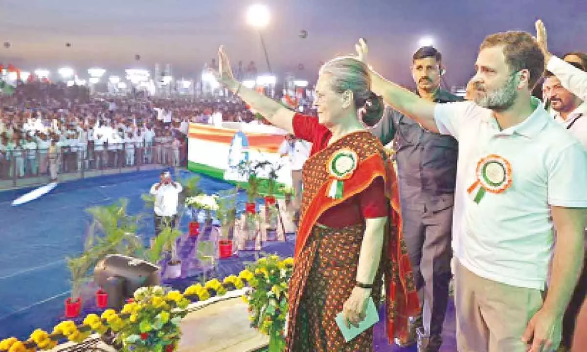 Congress leaders Sonia Gandhi and Rahul Gandhi waving to the crowd at the partys Vijayabheri meeting in Tukkuguda in Hyderabad on Sunday. Photo: G Ramesh