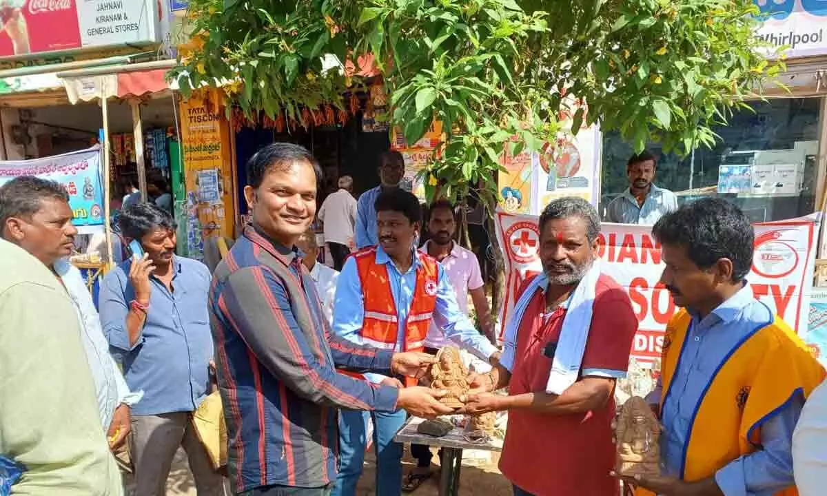Distribution of clay Ganesha idols under the auspices of Lions Club of Mulugu and Indian Red Cross Society Mulugu.
