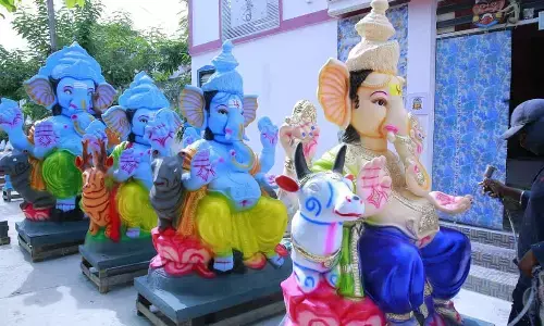 Balaya, a senior idol maker, giving final touches to Garuda Vinayaka at Bommala Quarters in Tirupati