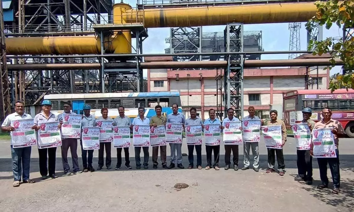 Leaders of trade unions releasing a poster in Visakhapatnam on Tuesday