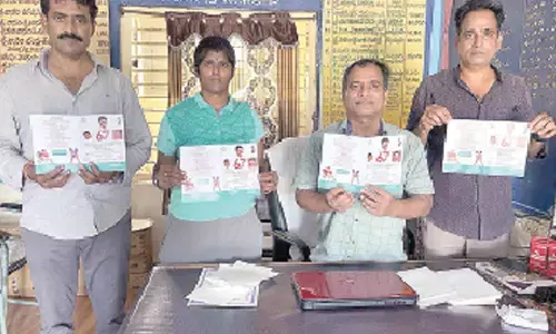 Wrestling championship invitation being released at Nunna ZP School near Vijayawada on Tuesday