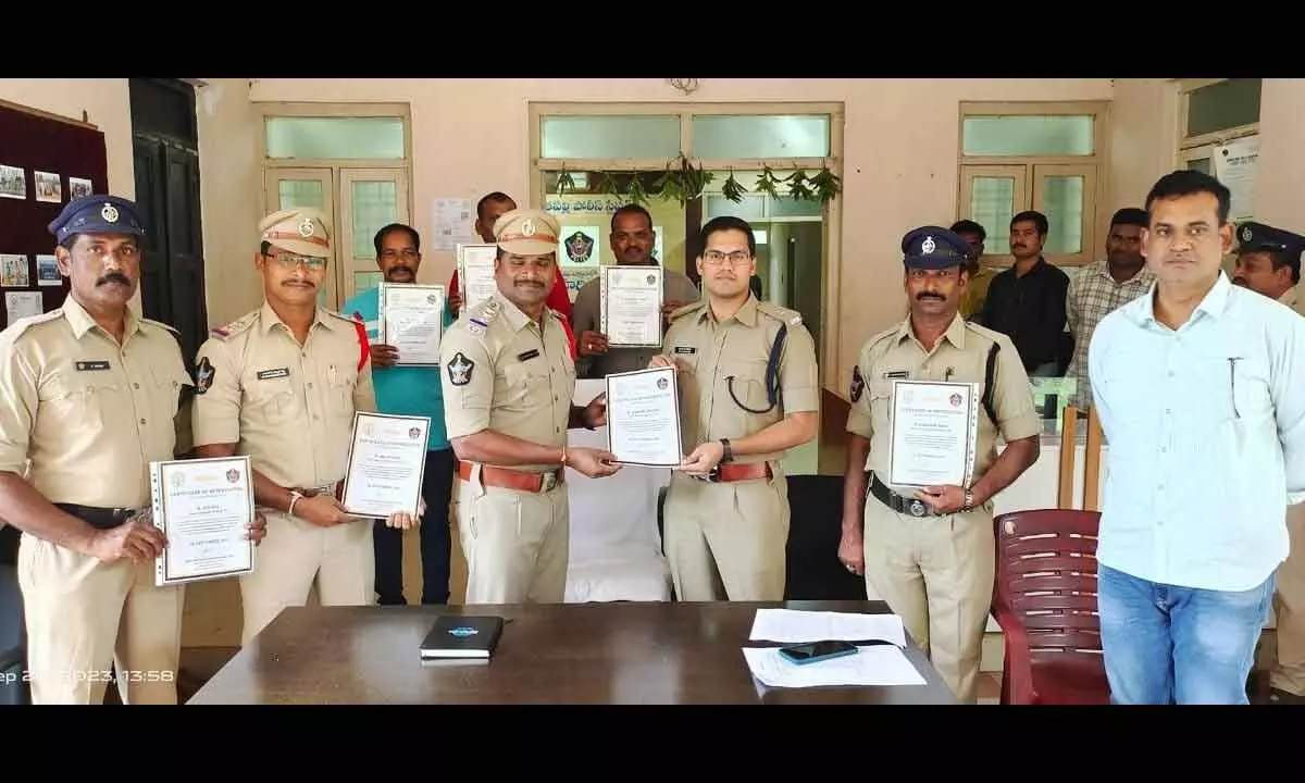 Additional SP K Pratap Siva Kishore appreciating Koyyur police staff for recovering stolen bikes in Rajamahendravaram on Wednesday