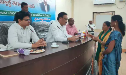 Chairman of ST commission DVG Sankara Rao receiving grievances from public in Parvathipuram on Wednesday