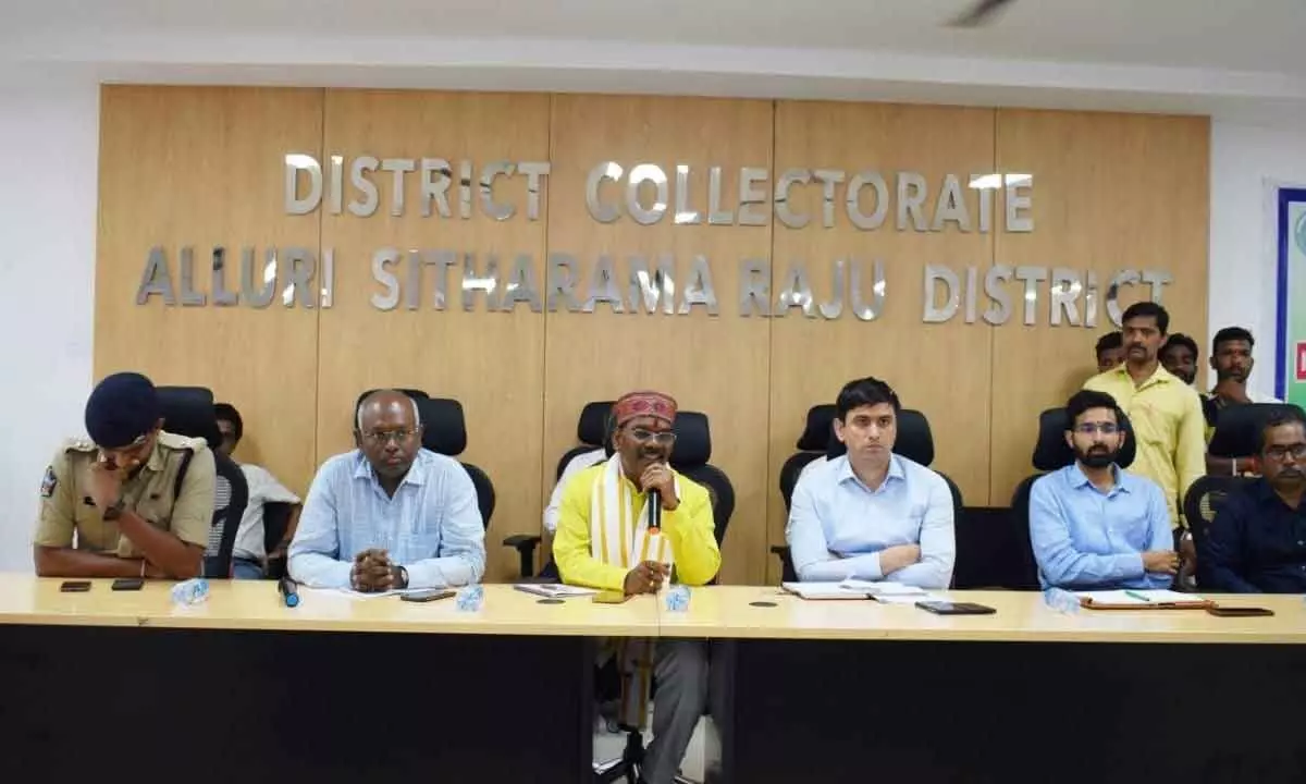 National Commission for Scheduled Tribes Member Ananta Nayak speaking at a meeting in Paderu on Friday. District Collector Sumit Kumar and other officials also seen.