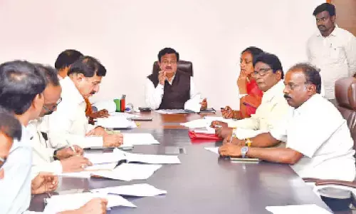 District Collector K Venkataramana Reddy speaking at a review meeting on polling stations rationalisation in Tirupati on Friday