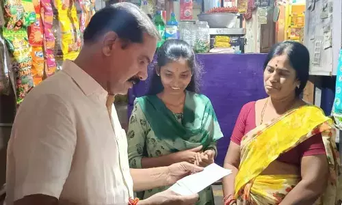 Chief Whip D Vinay Bhaskar with Keerthana, a poor student who secured MBBS seat in Hanumakonda on Friday