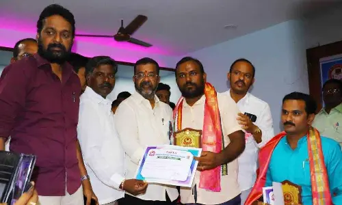Hanumakonda DCC president Naini Rajender Reddy giving away letters of appreciation to the best teachers at a programme organised by the Telangana All Private Teachers Association (TAPTA) at the Press Club in Hanumakonda on Sunday
