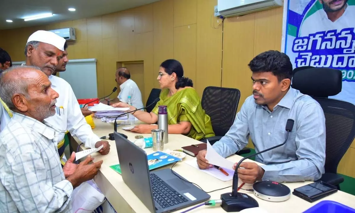 District Collector P Arun Babu receiving pleas at the  Spandana programme in Puttaparthi on Monday
