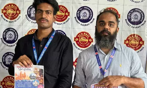 Ula Rail Product Director Vignesh and Train Manager Vijay Kumar launching the details of the special Yatras in Vijayawada on Monday