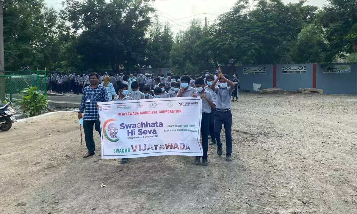 Students of VMC schools taking out an awareness rally in Vijayawada on Tuesday