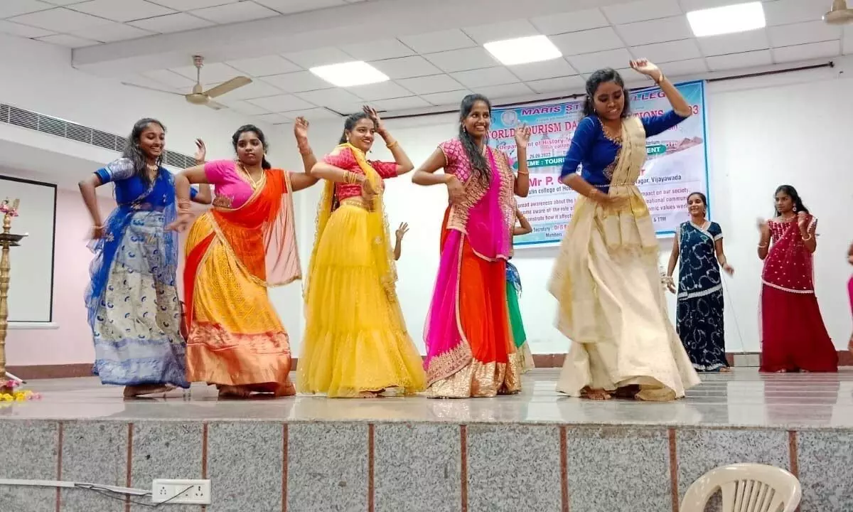 Students celebrating ‘World Tourism Day’ in Vijayawada on Tuesday