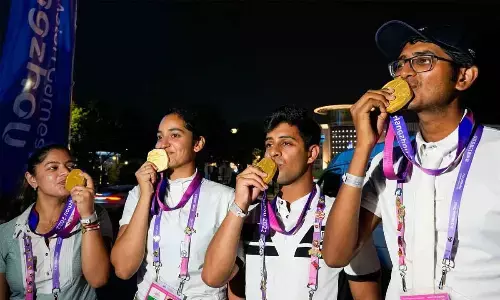Indias Hriday Vipul Chheda, Anush Agarwalla, Divyakriti Singh and Sudipti Hajela pose for photographs after winning the gold medal in the Eques	trian Dressage Team event at the 19th Asian Games, in Hangzhou, China on Tuesday