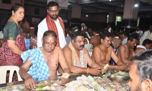 Durga Temple Trust Board Chairman Karnati Rambabu and EO D Bramaramba supervising the Hundi counting atop Indrakeeladri on Tuesday