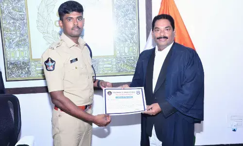 SP P Jagadeesh felicitating POCSO Court Special Public Prosecutor Pitani Srinivasa Rao