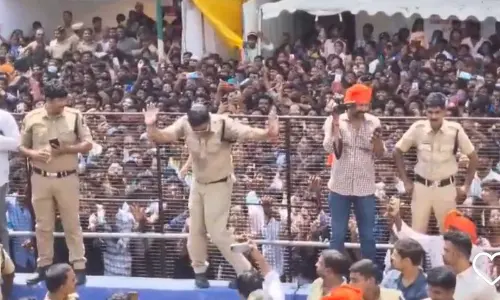 Police grooves on traditional dhol-tasha during Ganesh immersion