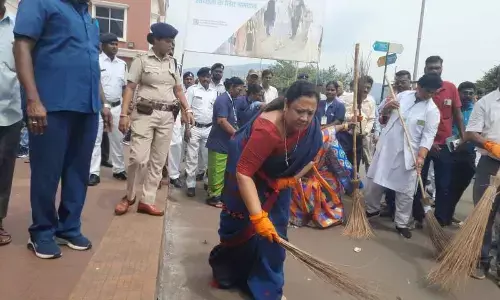 Officials, students, employees take part in clean-up drive