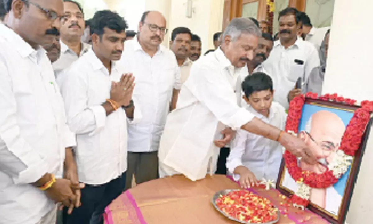 Minister for Energy, Forests and Environment Peddireddi Ramachandra Reddy paying floral tributes to Mahatma Gandhi to mark his 154th birth anniversary in Tirupati on Monday.