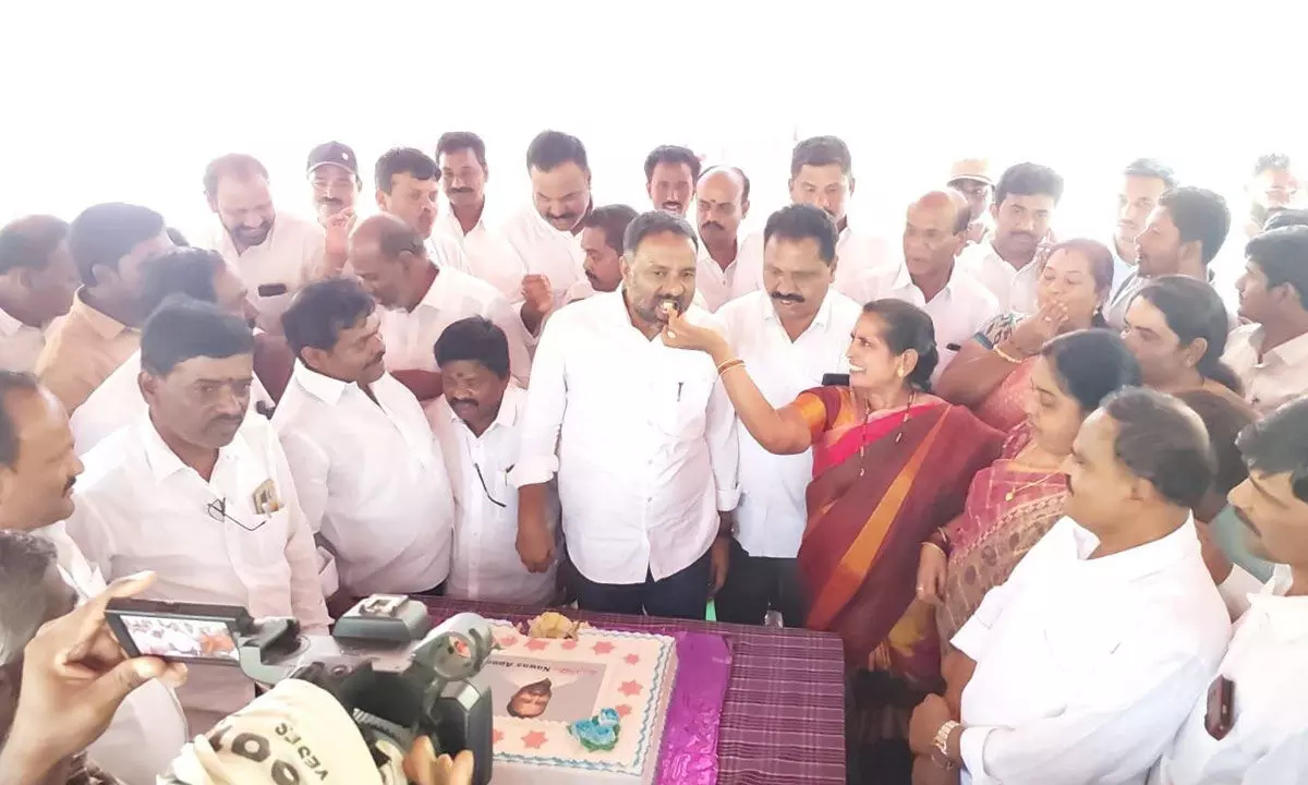 YSRCP MLA Mohamma Nawaz Basha celebrating his birthday by cutting a cake at Agriculture Market yard amidst party leaders and activists in Madanapalle on Monday.