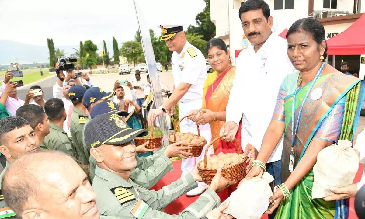 Seed balls being given to the naval personnel to disburse them in various locations through helicopters