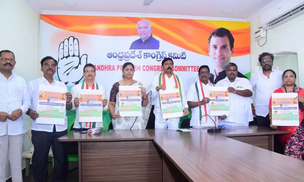 Congress leaders releasing ‘Save the Nation – Save Democracy’ posters at Andhra Ratna Bhavan in Vijayawada on Monday