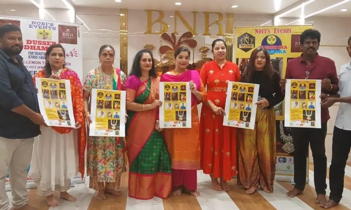 Programme organiser N Naga Pallavi and others releasing Dasara Dhamaka posters at BNR Gold and Diamonds showroom on MG Road on Monday