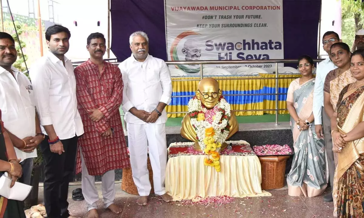 NTR district Collector S Dilli Rao, VMC Commissioner Swapnil Dinkar Pundkar, Central MLA Malladi Vishnu and others paying tributes to Mahatma Gandhi in Vijayawada on Monday